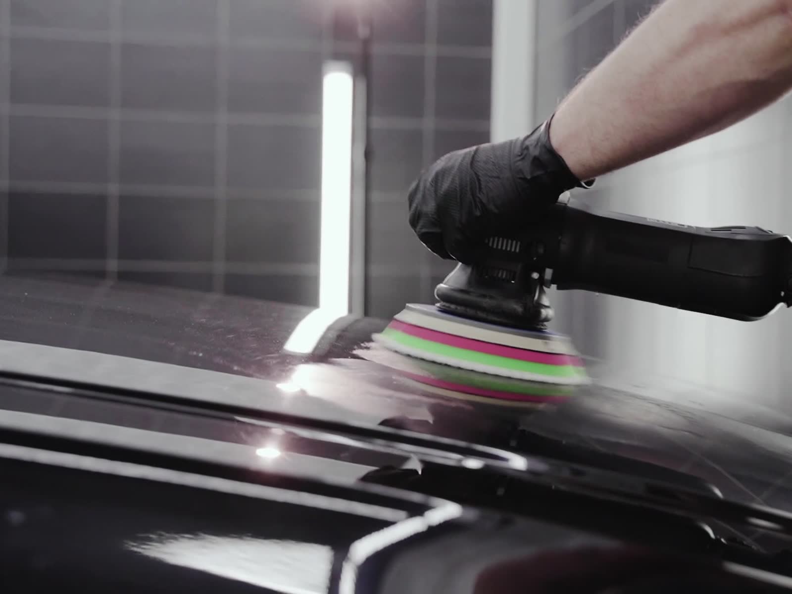 A microfiber towel gliding over a freshly polished fender.